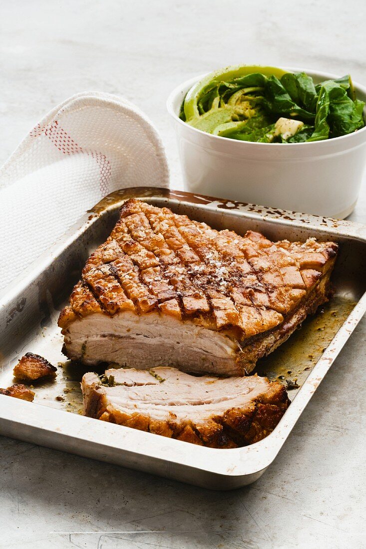 Roast pork belly with rosemary and thyme