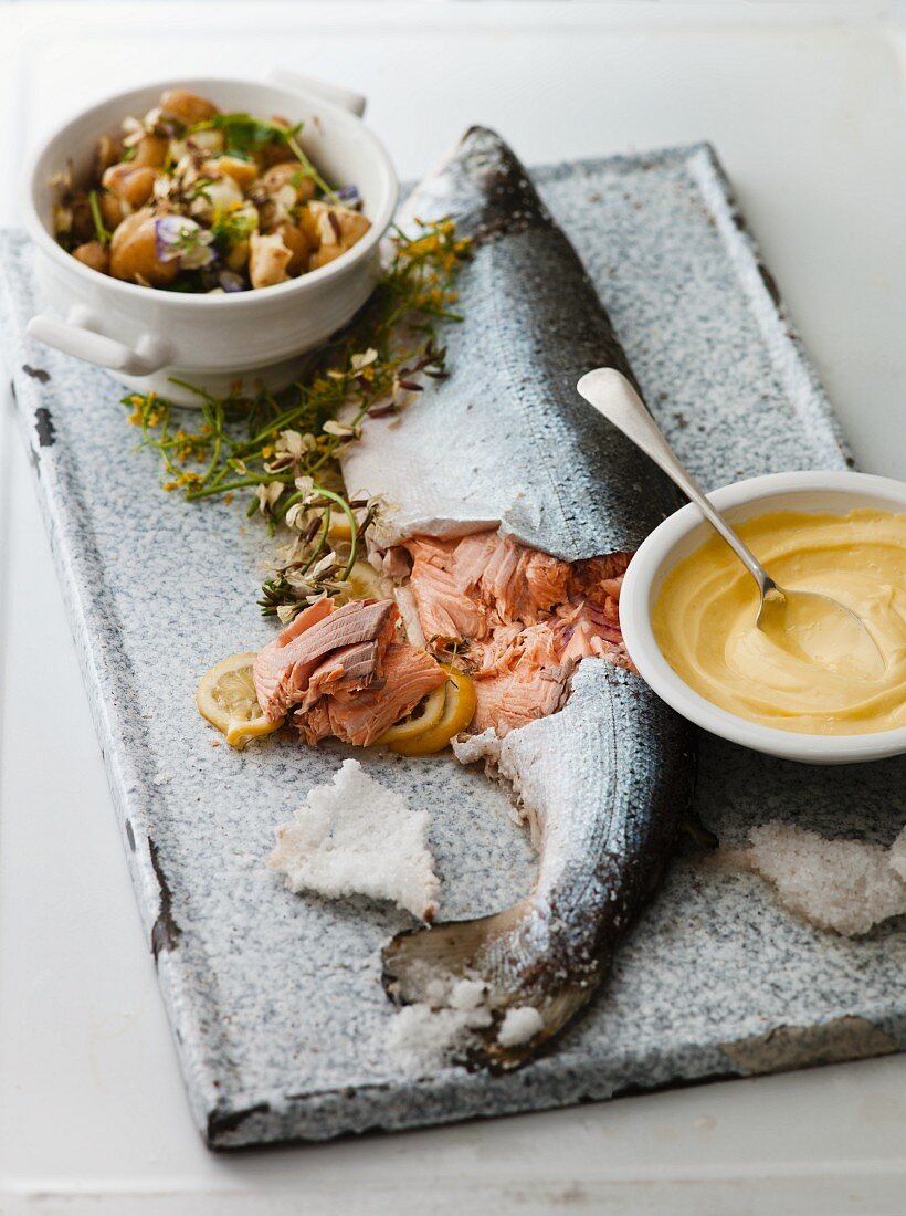 Salmon with a salt crust, mayonnaise and a side salad