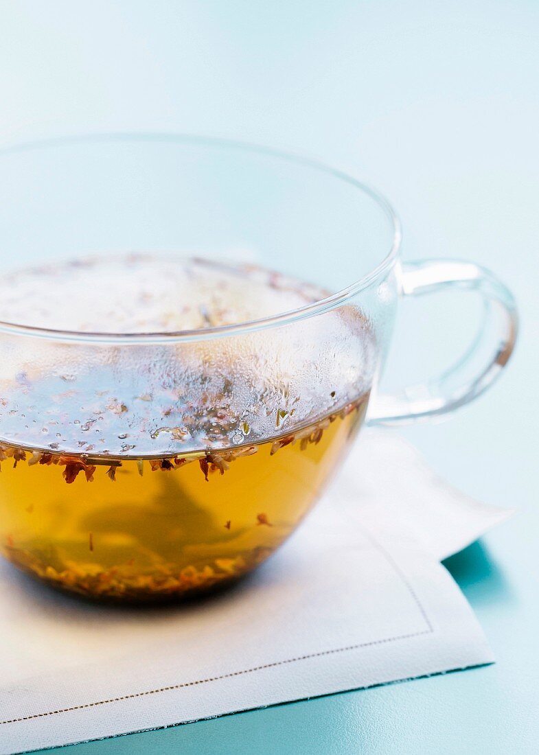 Hot tea in a glass mug