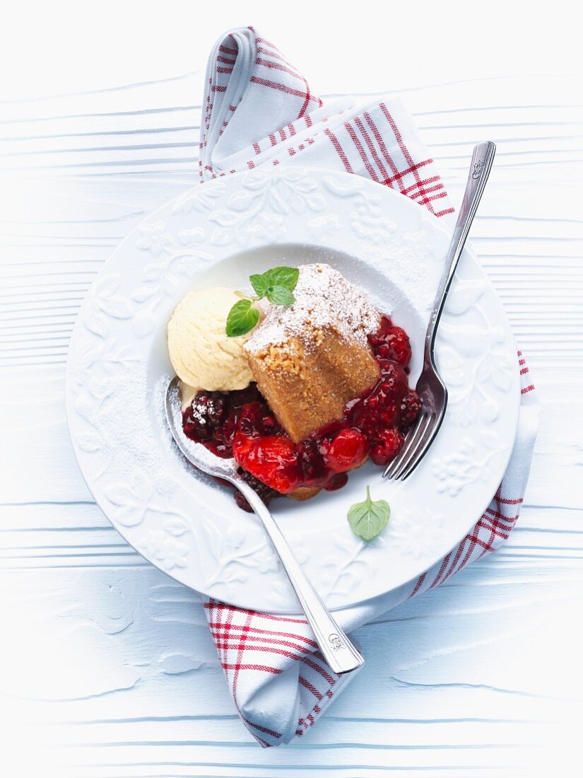 Berry pudding with vanilla ice cream