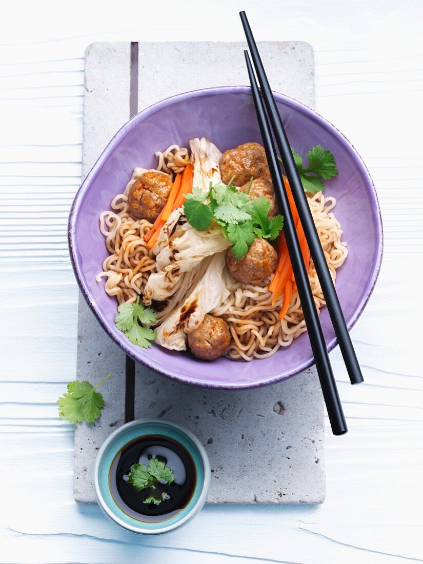 Spicy meatballs with Chinese cabbage and noodles