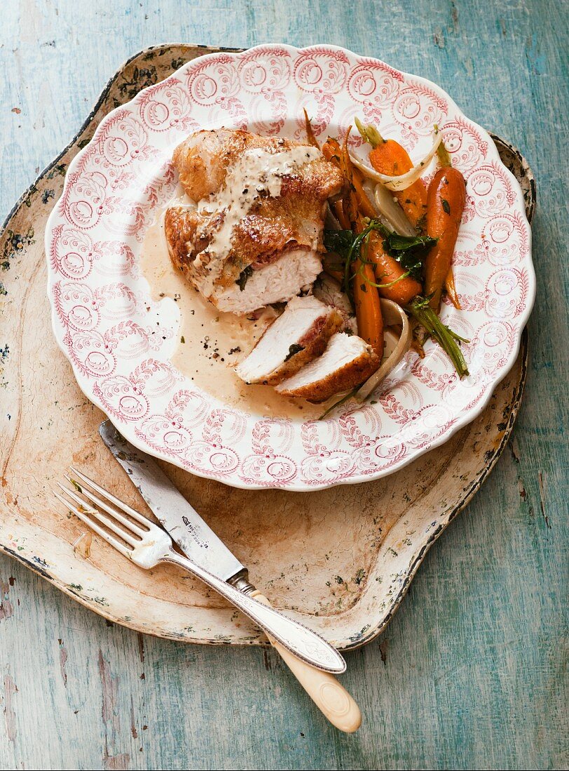 Chicken breast with a carrot and artichoke salad