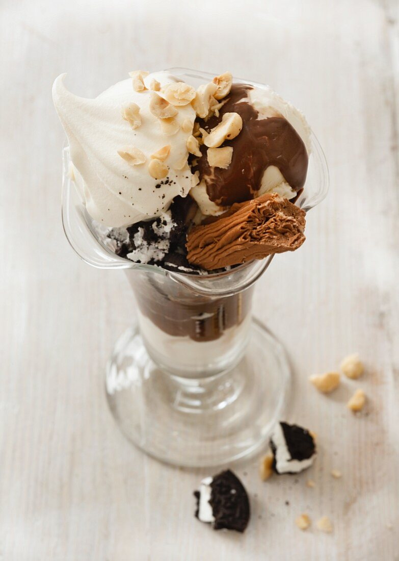 Chocolate sundae with cream and nuts