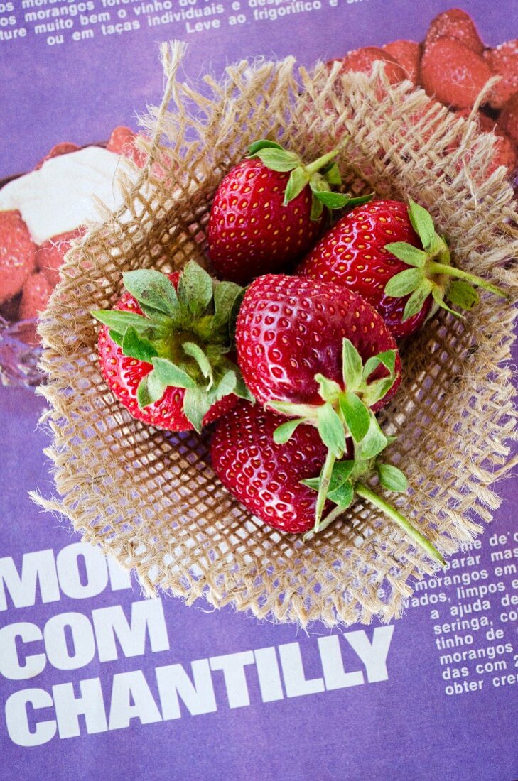 Fresh strawberries on a piece of hessian