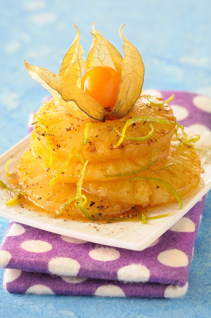 Caramelised pineapple slices with black pepper and lime zest