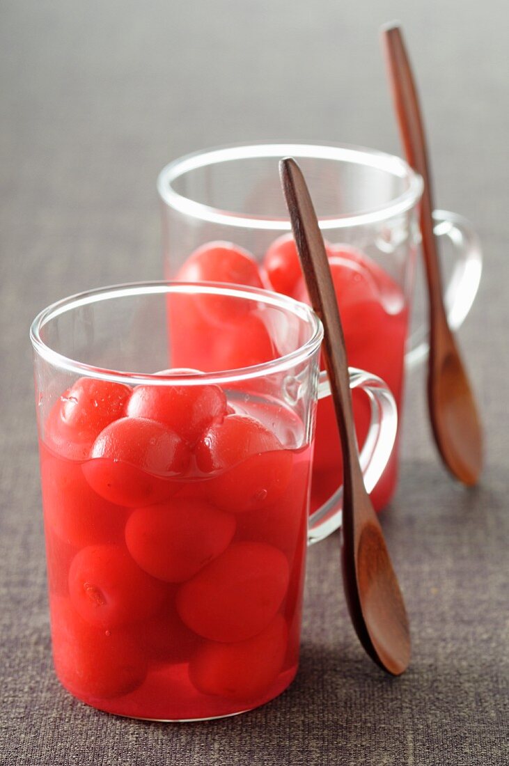 Stewed cherries in glass mugs
