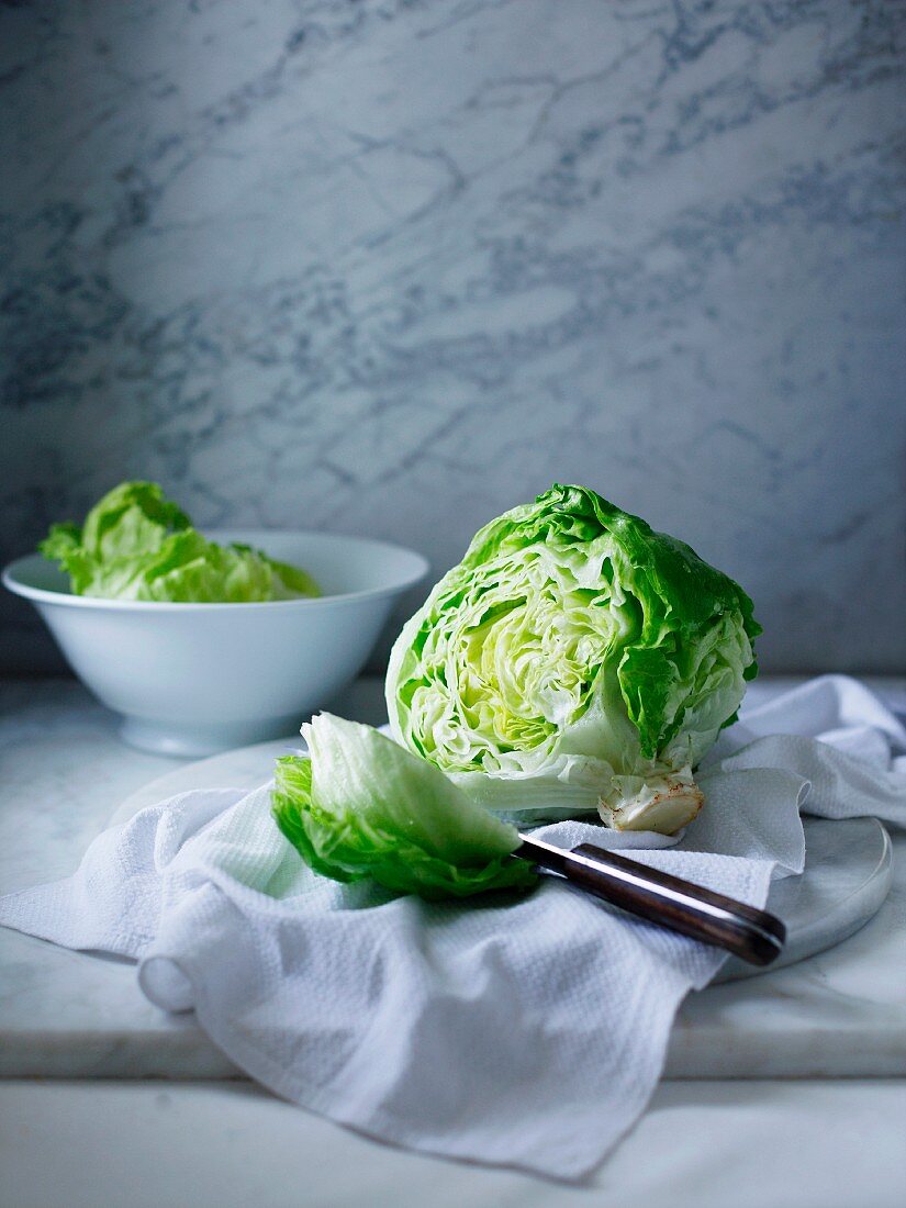 Iceberg lettuce on white tea towel
