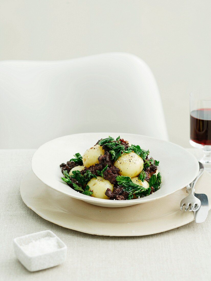Steamed potatoes with blood sausage and barley