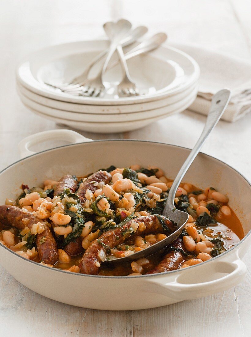 Spicy Merguez sausages with spinach and white beans