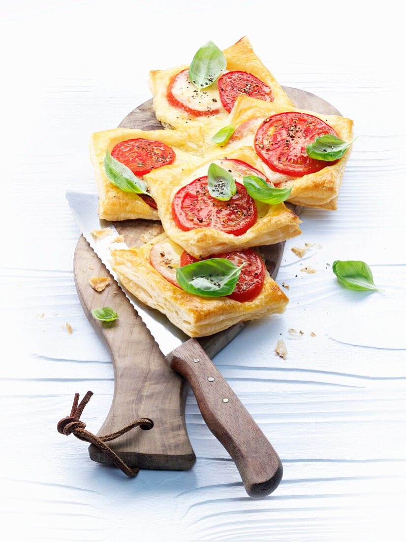 Puff pastry slices with tomatoes and basil