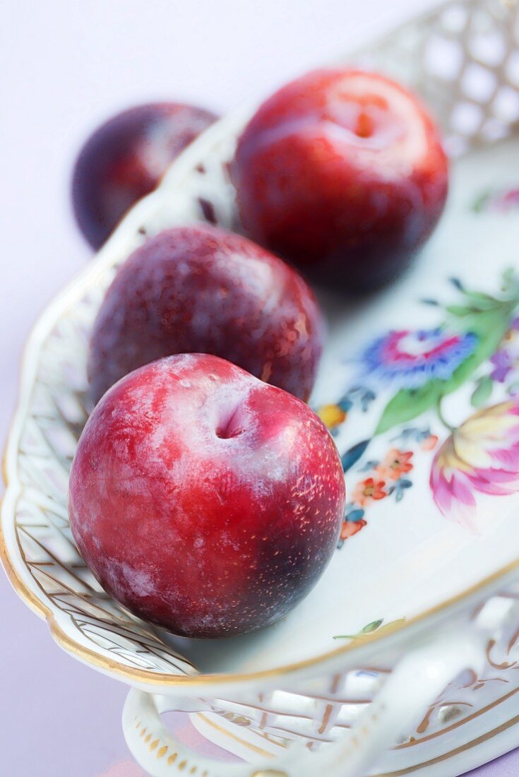 Plums in a porcelain dish