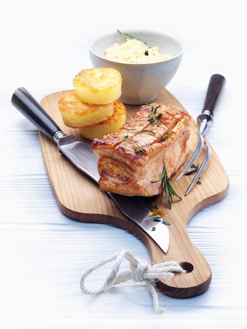 Collar of suckling pig with creamed sauerkraut and napkin dumplings