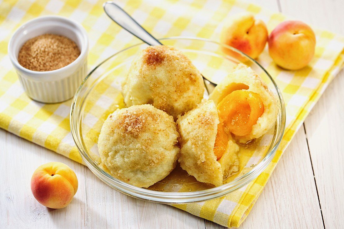 Apricot dumplings with buttery breadcrumb topping and cinnamon sugar