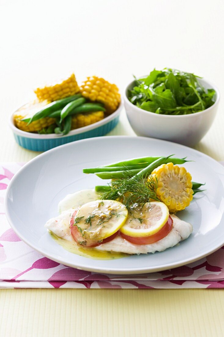 Poached fillet of fish with vegetables and a dill and butter sauce