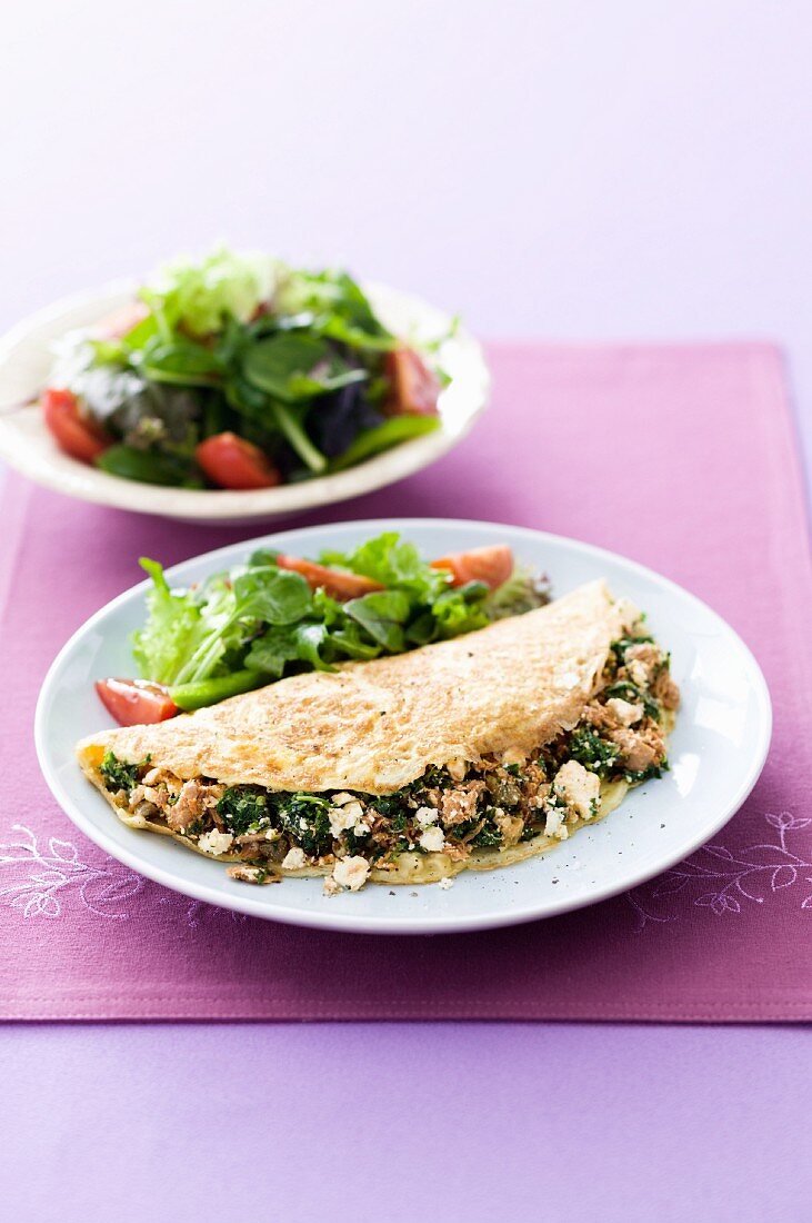 An omelette filled with tuna, spinach and feta