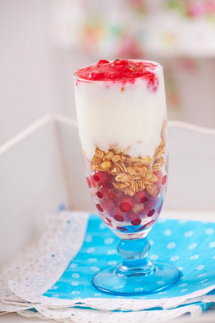 A layered dessert of redcurrants, porridge oats and yoghurt