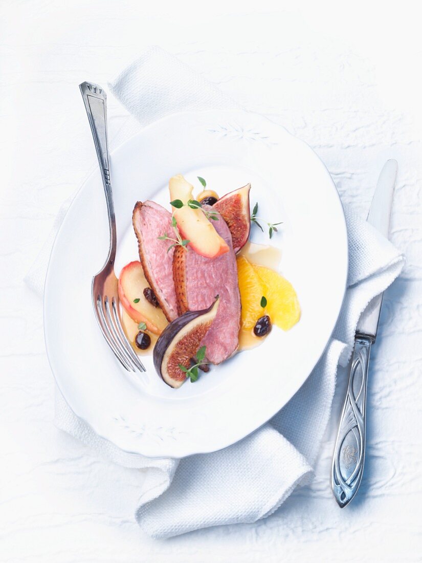 Duck breast with fruit and an orange sauce