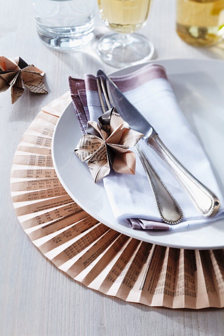 Place mat & plate decorations made from folded newspaper