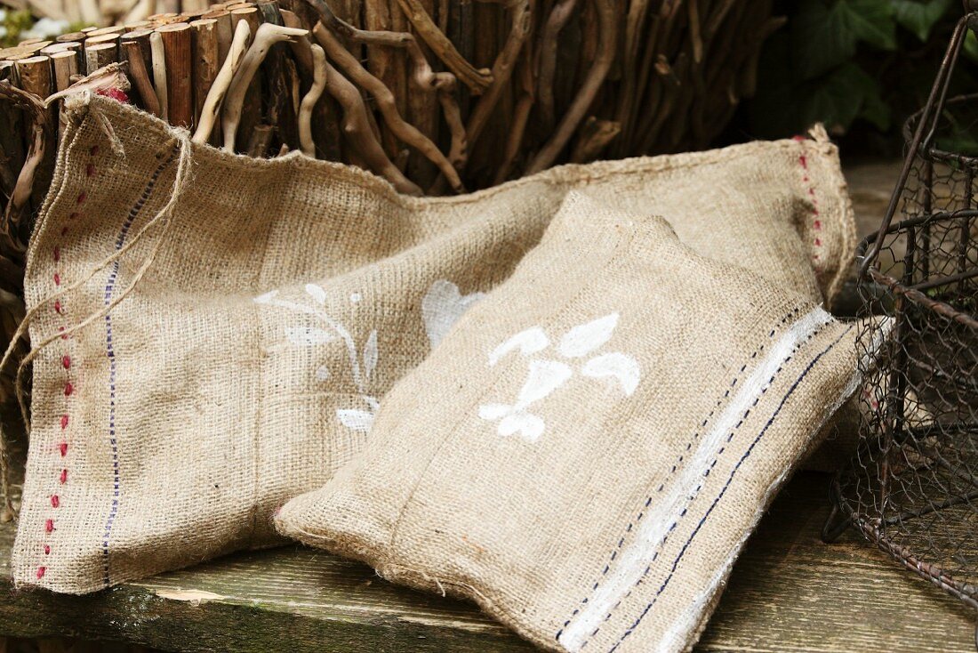 Hand-sewn hessian cushions on rustic garden bench