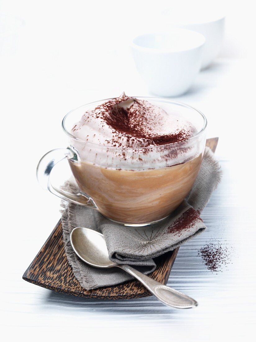 Coffee mousse with cream and cocoa powder