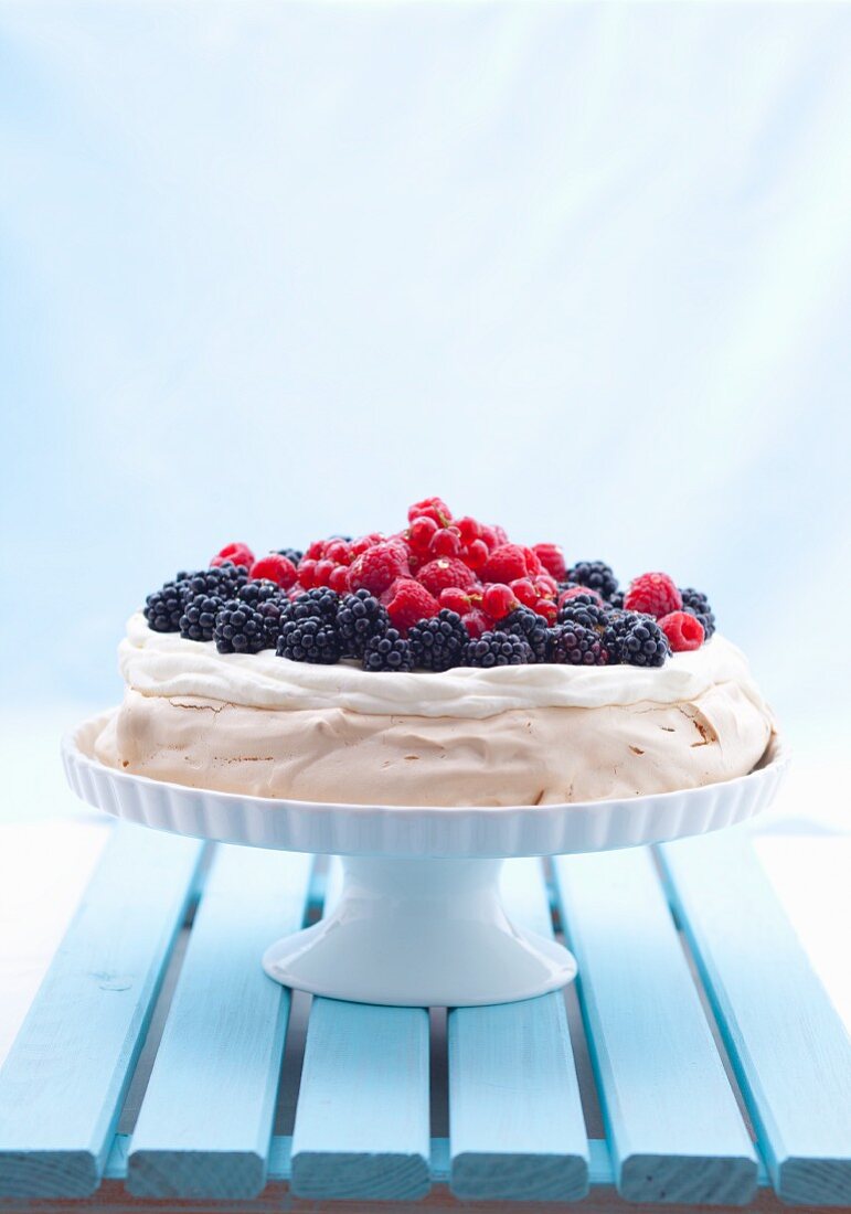 Berry pavlova on a cake stand