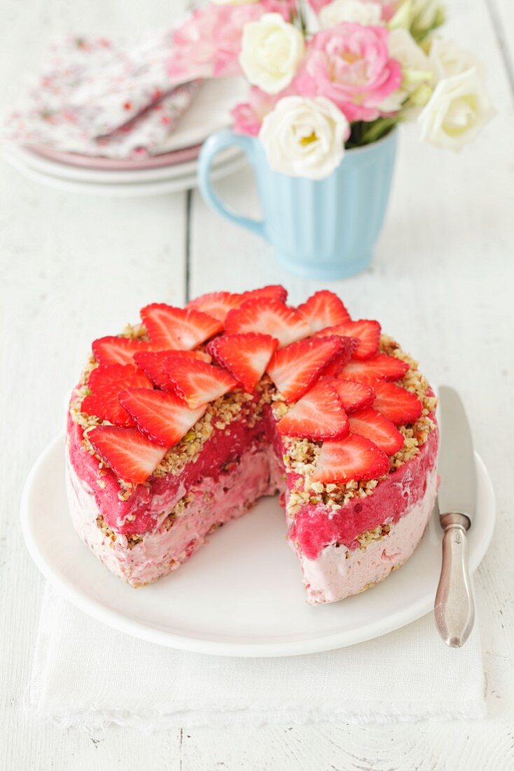 Strawberry ice cream cake with strawberry sorbet and nuts