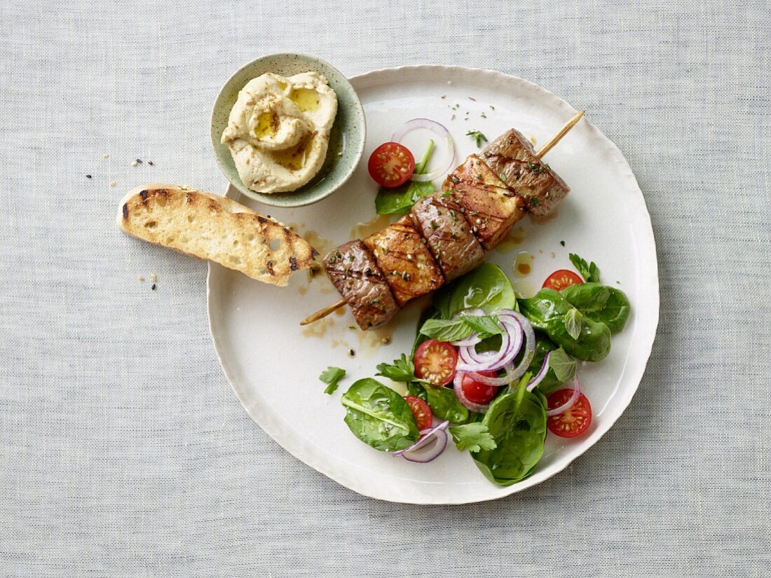 Lamb kebabs with a side salad