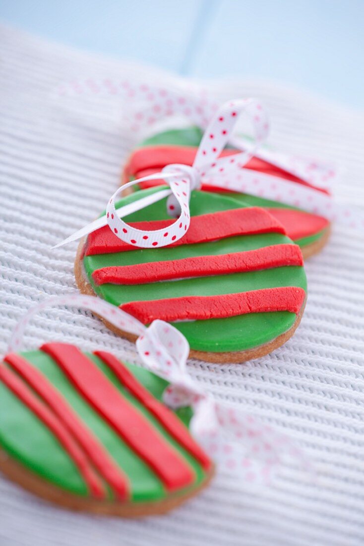 Gingerbread Christmas bauble garnished with marzipan and ribbon