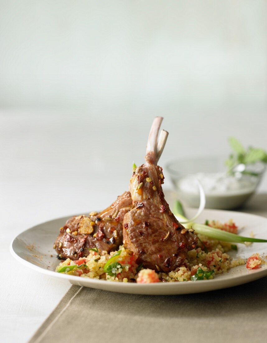 Lamb cutlets with herb butter on couscous