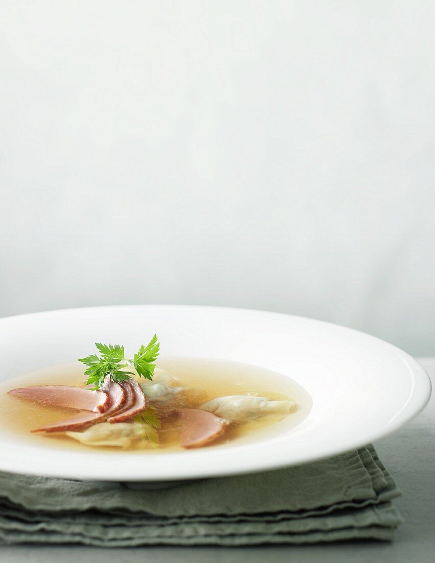Duck consomme with ravioli