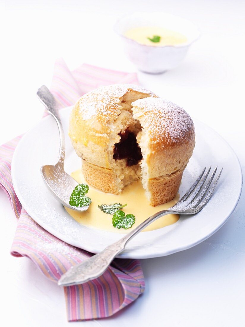 'Rohrnudeln' (Bavarian hot cross buns) with plum jam and vanilla sauce