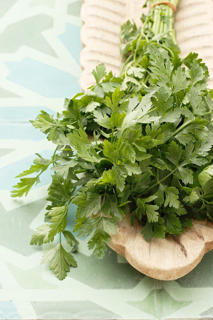 Fresh parsley on a wooden serving platter