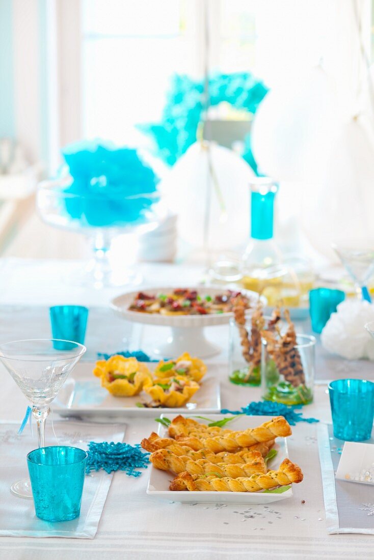 A table set for a party with assorted nibbles