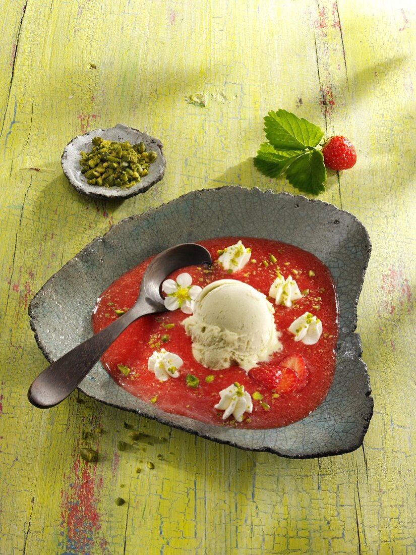 Cold strawberry soup with pistachio ice cream and pistachios