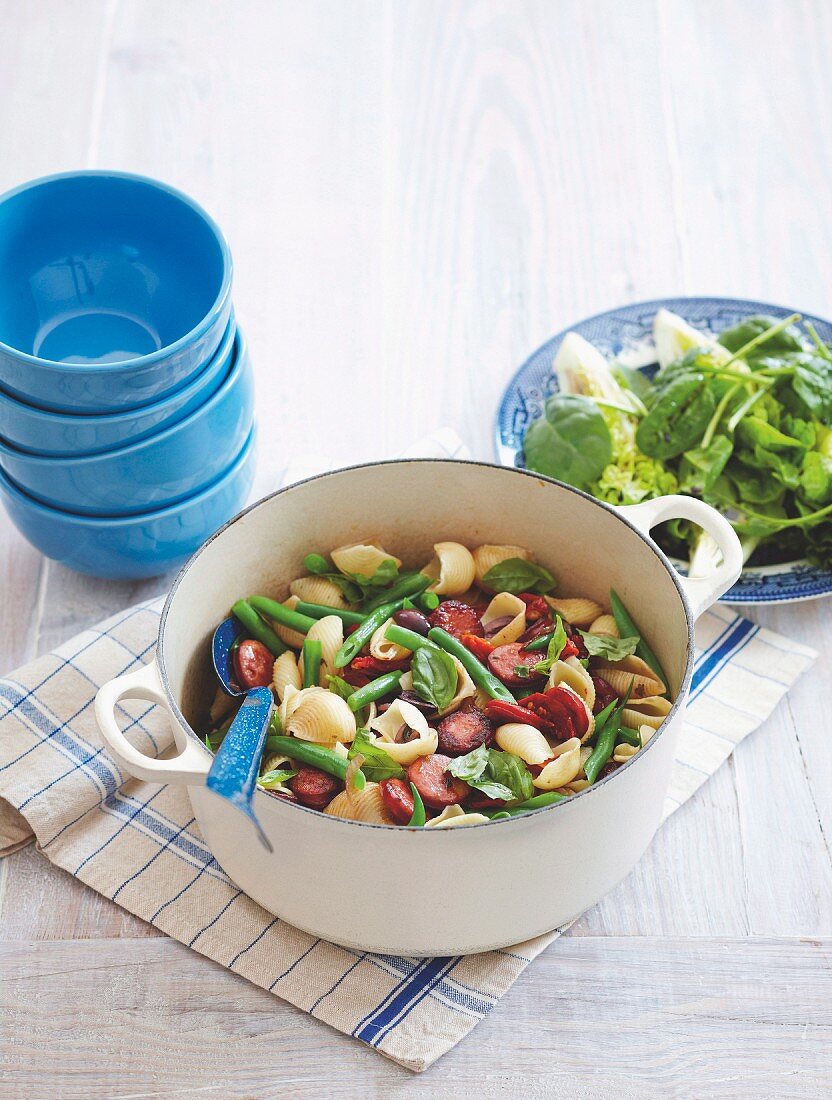 Pasta shells with chorizo, beans, olives and basil