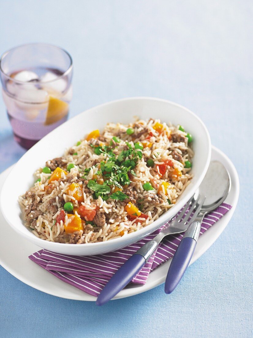 PIlaf with ground lamb, pumpkin, peas and tomatoes