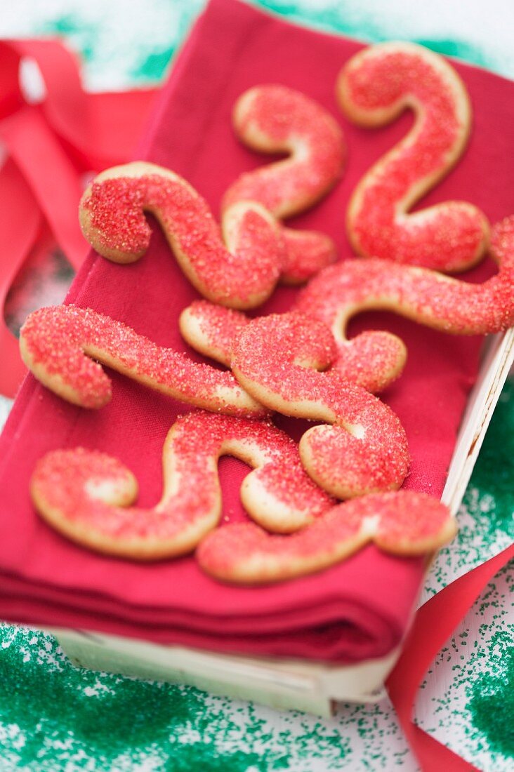 S-shaped butter cookies with red sugar sprinkles