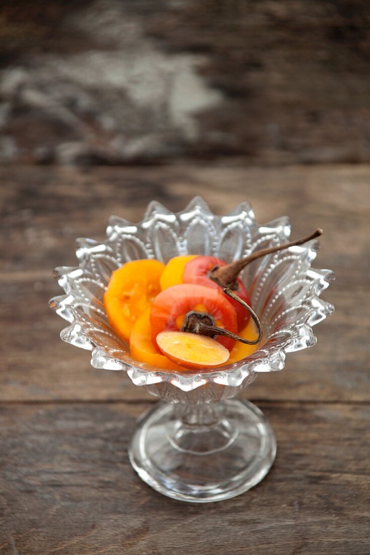 Sliced Japanese persimmon in a crystal dish