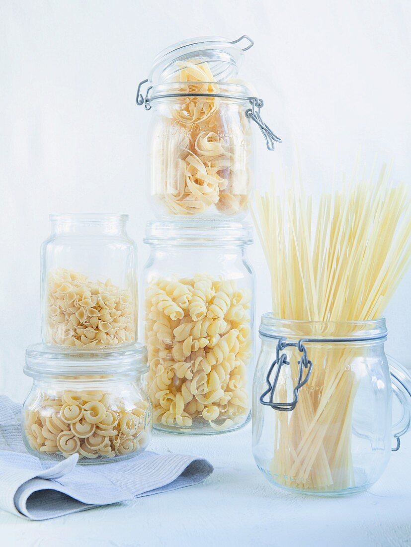 Durum wheat pasta (linguine, tagliatelle, soup pasta) in storage glasses