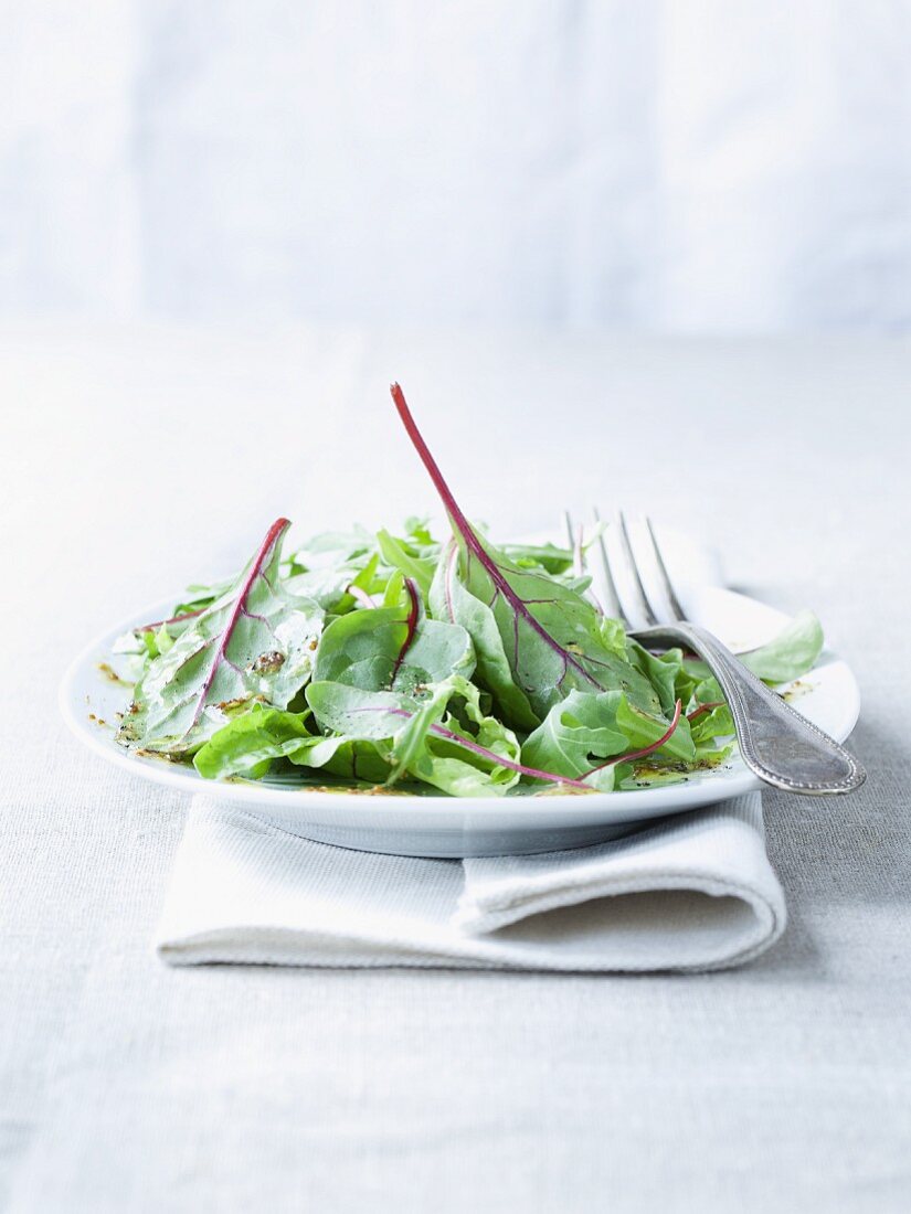 A salad of young chard leaves with a honey and mustard dressing