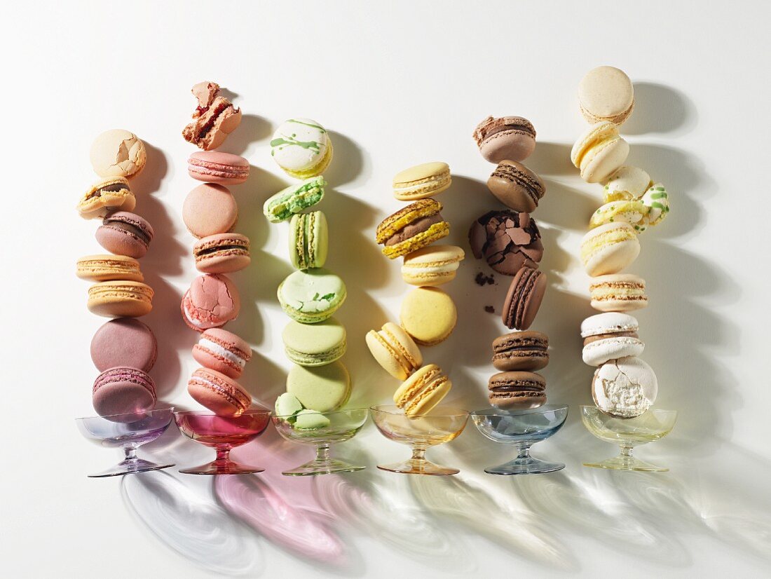 Assorted colourful macaroons in adjacent rows