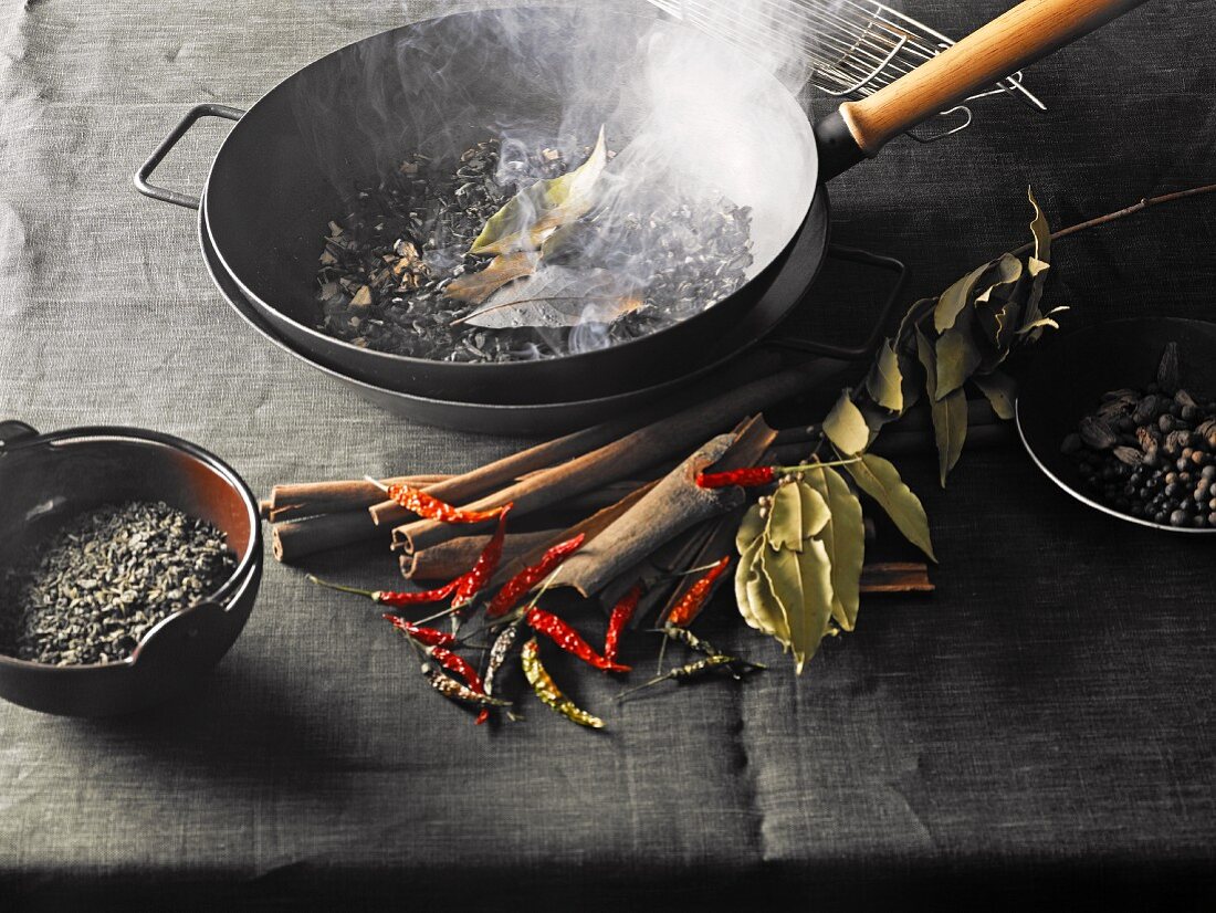 A still life featuring ingredients and utensils for smoking