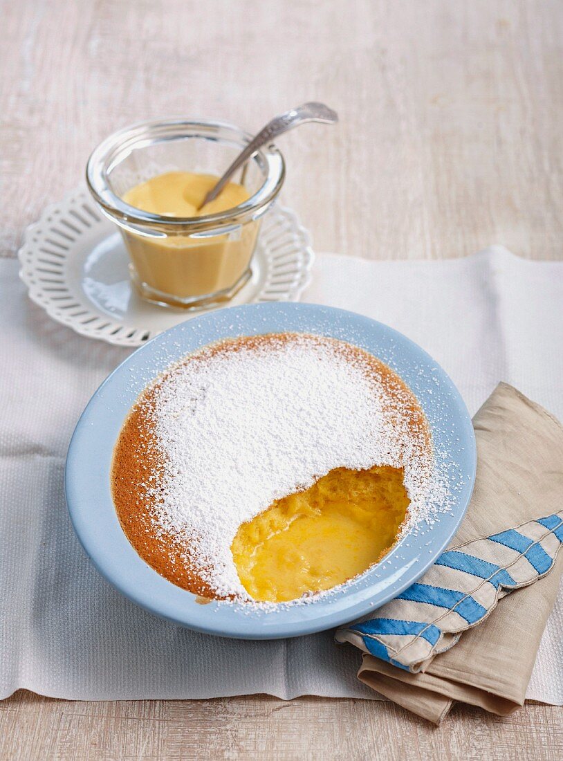 Baked pudding with orange and passion fruit, served with custard