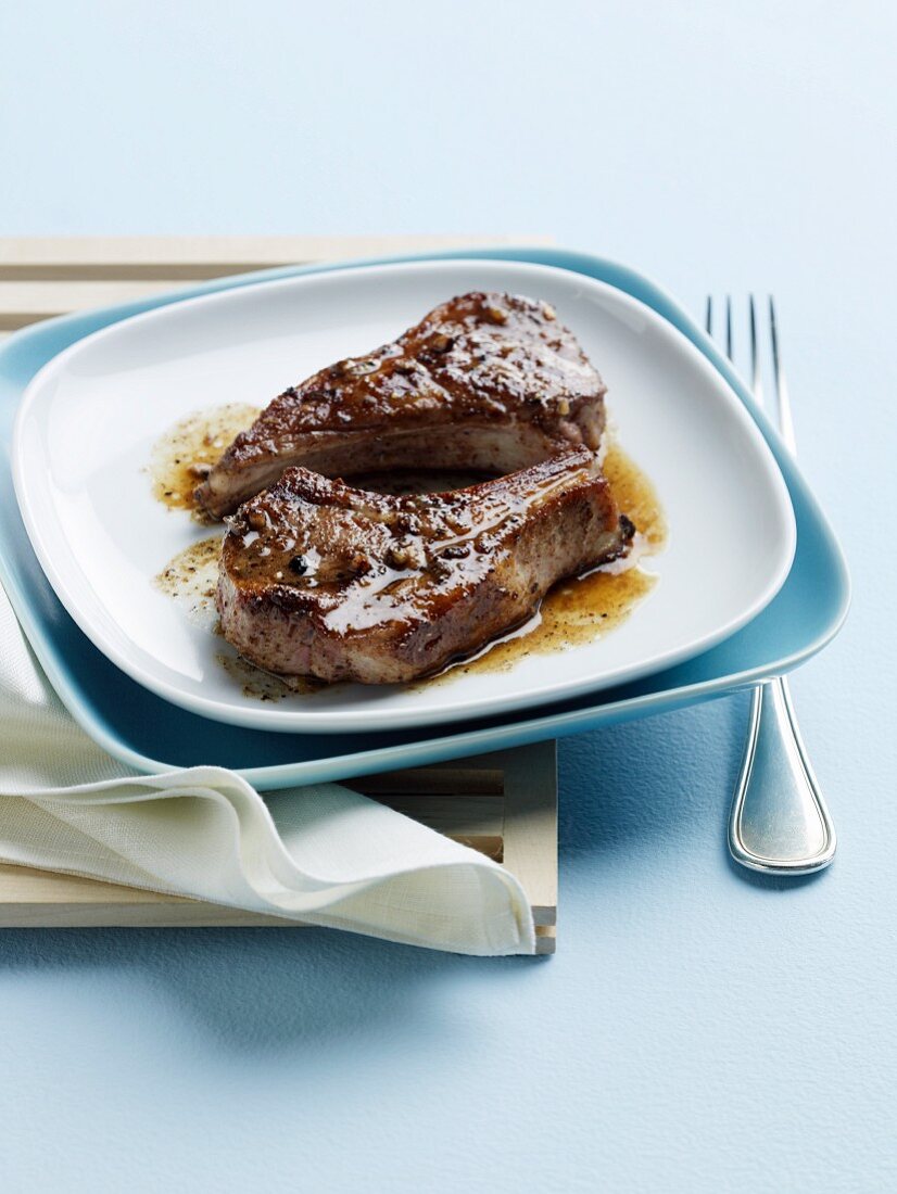 Szechuan Lamb Chops on a White Plate