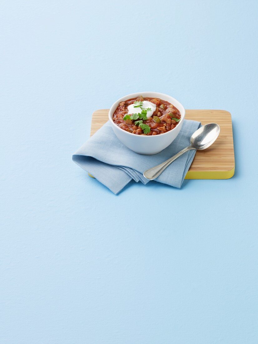 A Bowl of Chili with a Dollop of Sour Cream