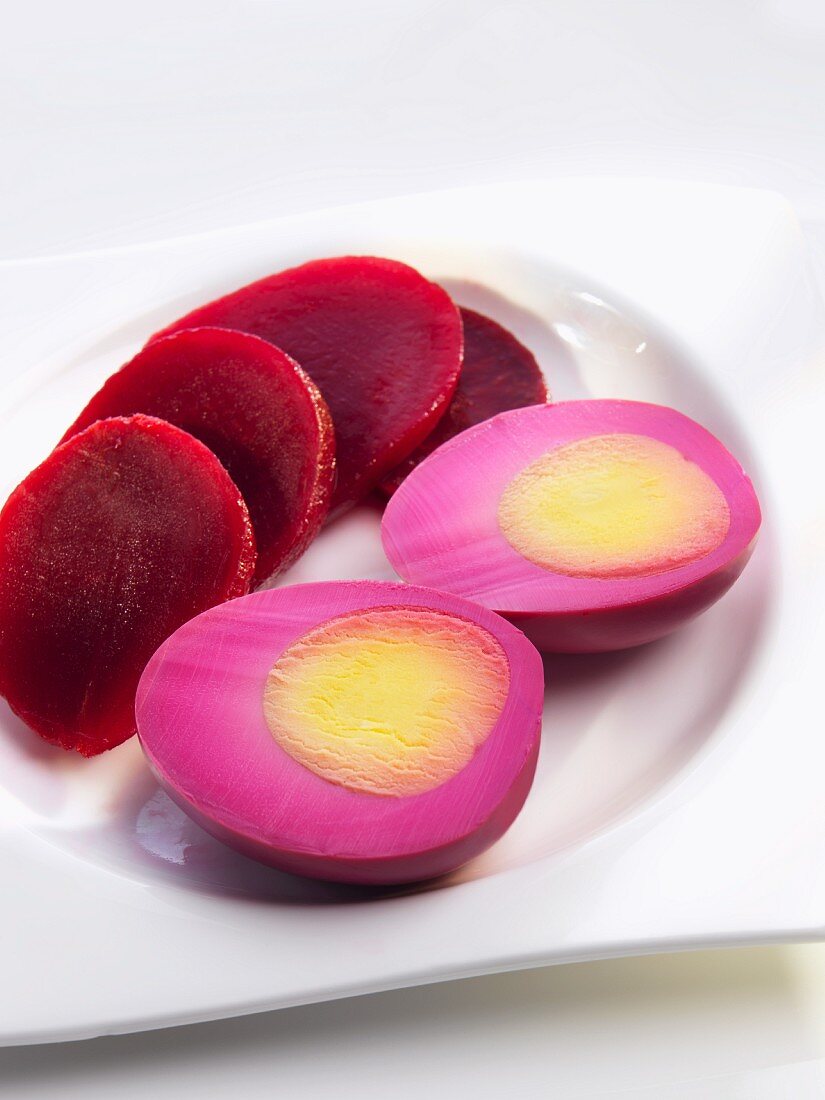 Sliced Beets and a Hard Boiled Egg Boiled in Beet Juice