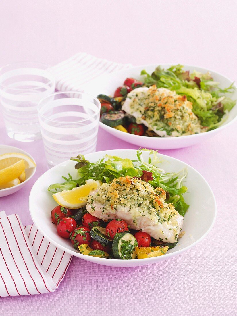 Fish with a parsley crust on a bed of salad