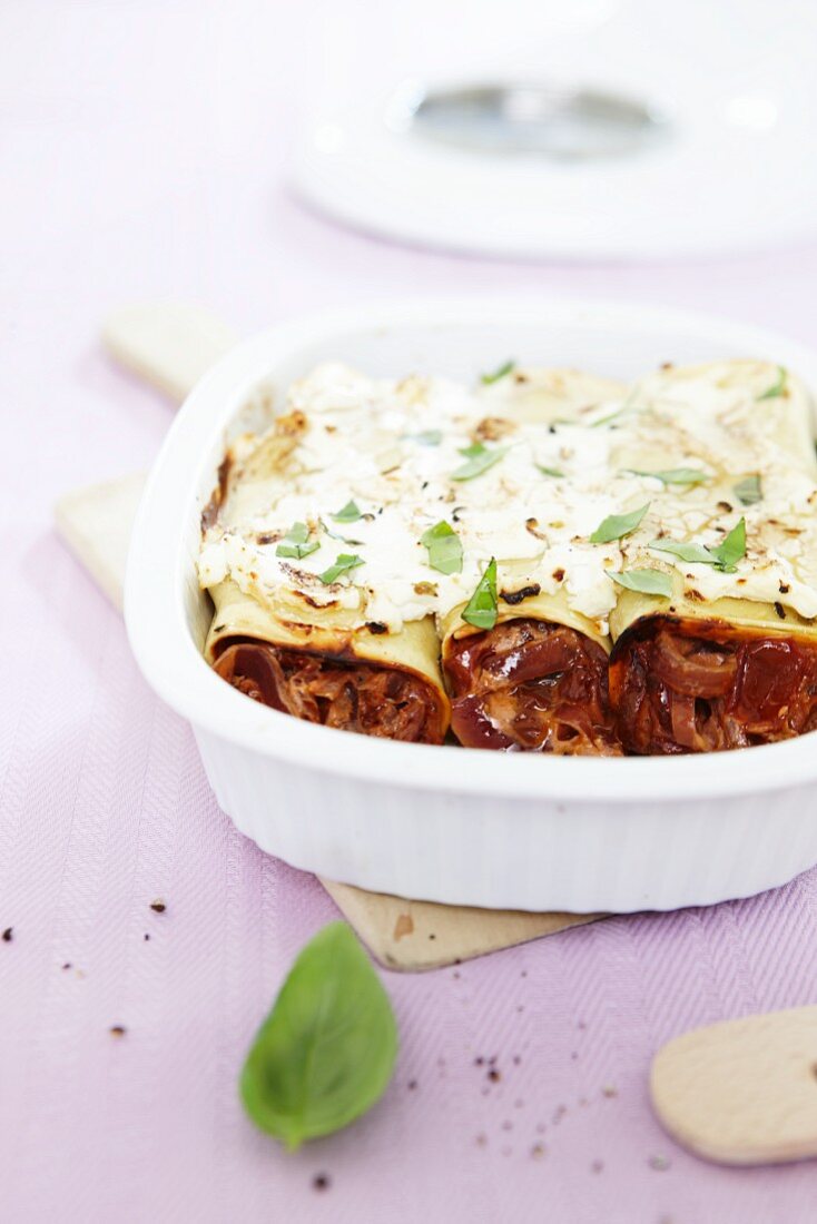 Cannelloni topped with feta and baked