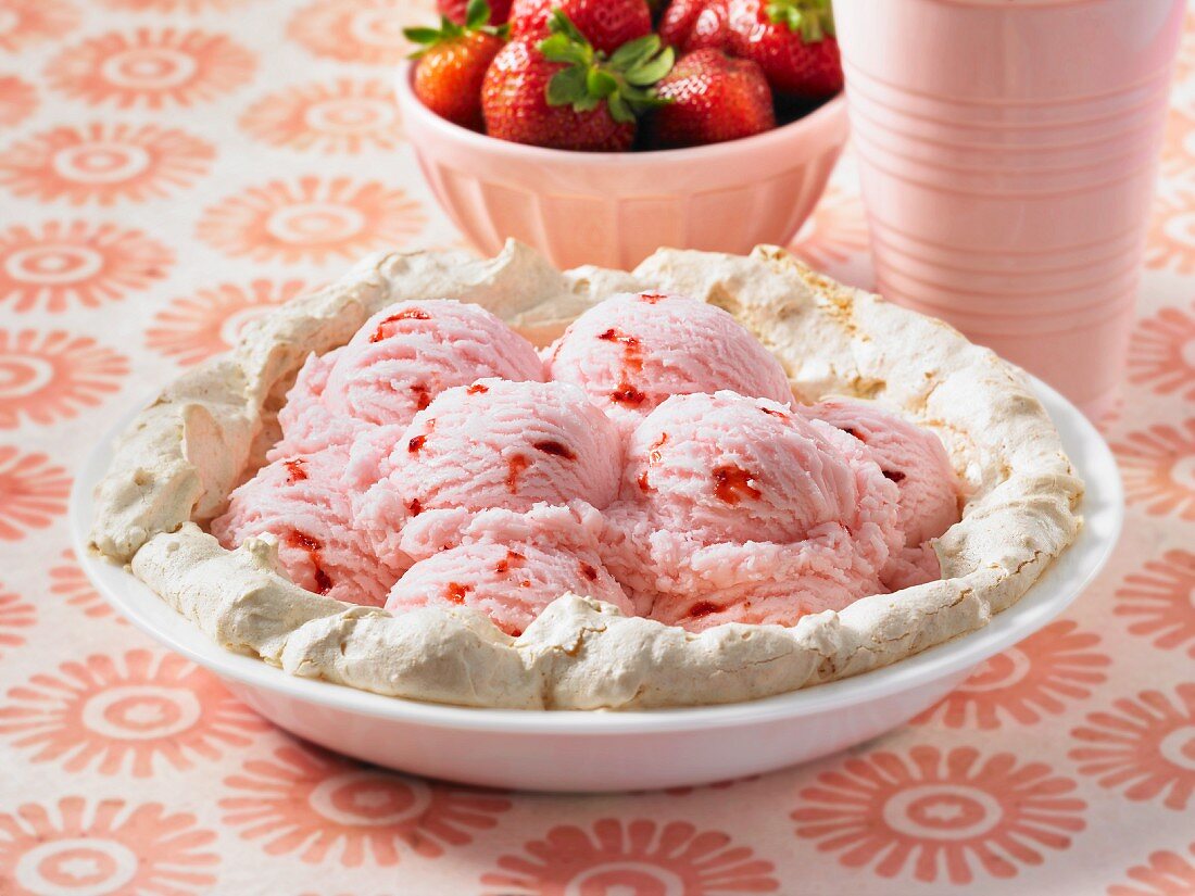 Meringue base filled with strawberry ice cream