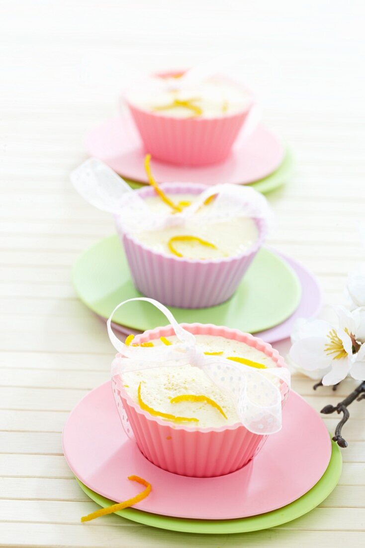 Orange panna cotta in pastel moulds